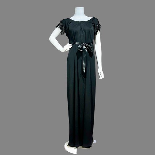 Lucie Ann Beverly Hills black caftan with waterfall back and beaded sleeves.